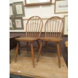 A pair of mid-20th century beech kitchen chairs