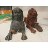 A cast bronze sphinx along with a cast iron recumbent lion CONDITION REPORT: Both