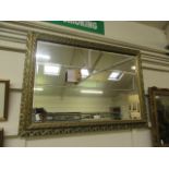 An ornate framed bevel glass mirrror