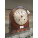 An early 20th-century oak cased mantle clock