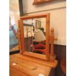 A pine toilet mirror