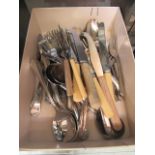 A box containing an assortment of flatware