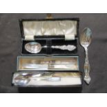 A silver hallmarked spoon in presentation box together with a silver hallmarked mother of pearl