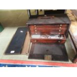 An early-20th century engineers tool chest with an assortment of tools