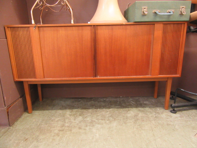 A mid-20th century teak stereo cabinet CONDITION REPORT: This lot consists of only a