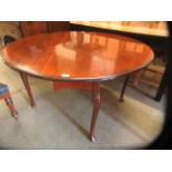 An 18th century style mahogany drop leaf table