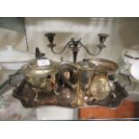 A plated two handled tray together with an assortment of plated ware to include teaopt, cream jugs,