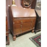 A mid-20th century oak fall front bureau