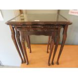 A nest of three mid-20th century mahogany effect occasional tables