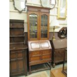 An early-20th century oak bureau bookcase