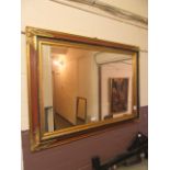 A reproduction gilt edged rectangular wall mirror