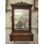 An early-20th century wall mounted hall mirror with glove box