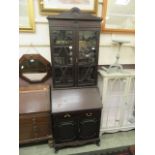 An early-20th century mahogany bureau bookcase