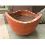 A large terracotta garden planter