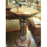 A reproduction mahogany jardiniere stand