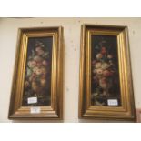 A pair of gilt framed oleographs of still life