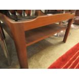 A mid-20th century design teak occasional table with a smoked glass top