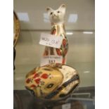 A Royal Crown Derby paperweight of cat together with a Royal Crown Derby paperweight of curled up