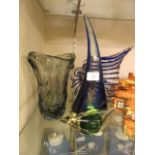 Three pieces of heavy coloured glassware to include a shell design water jug, grey green vase,