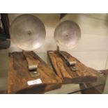 Two modern metalwork candle holders on driftwood plaques