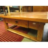 A substantial modern pine square coffee table