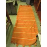 A mid-20th century design orange striped throw