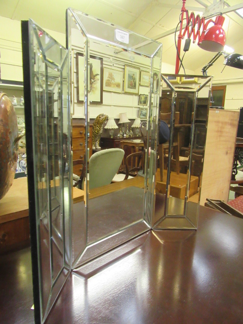 A modern art deco style triple vanity mirror