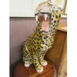 A large ceramic model of a leopard