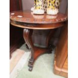 An eastern hardwood circular topped occasional table