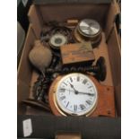 A tray containing clocks, a barometer, candle sticks,