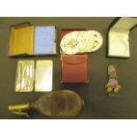 A collection of items to include a shot pouch, a small tin of tools, circular playing cards,