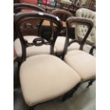 A harlequin set of four balloon back dining chairs