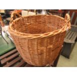 A large wicker dog basket