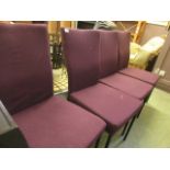 A set of four industrial style metal supported chairs upholstered in a purple fabric