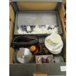 A tray containing a blue and white tea set, coasters,