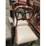 A pair of Victorian balloon back mahogany dining chairs