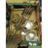 A tray containing an assortment of metalware to include a part fireside companion set, candle stick,