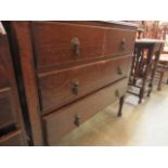 A mid-20th century oak three drawer chest