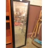 A mirror fronted cabinet