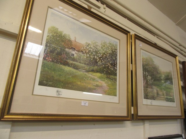 Two framed and glazed limited edition prints of country garden scene signed in pencil