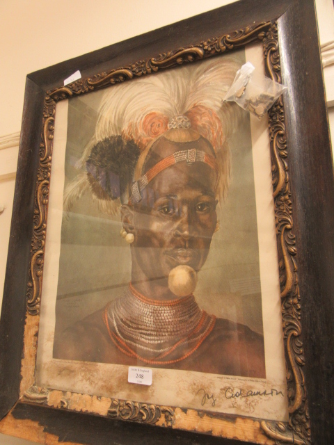 An oak framed and glazed print of African man