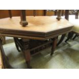 An Edwardian walnut low level occasional table with under tier