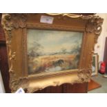 A gilt framed oil on board of a country river scene signed bottom right