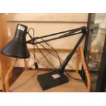 A modern angle poise style reading lamp