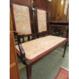 An Edwardian mahogany inlaid two seater settee