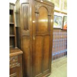 An early 20th century oak hall cupboard