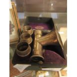 A plated four piece hearing instrument in fitted case