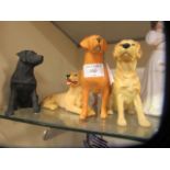 A Beswick model of labrador together with three other resin labradors