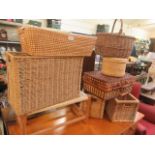 A selection of wicker baskets together with a wicker seated stool