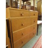 A mid-20th century oak chest of two short over three long drawers